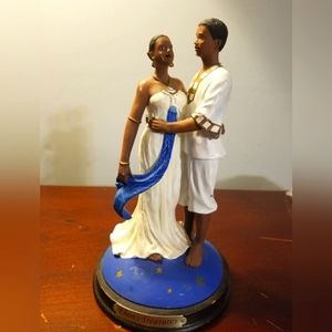 Ebony treasure man & woman figurine